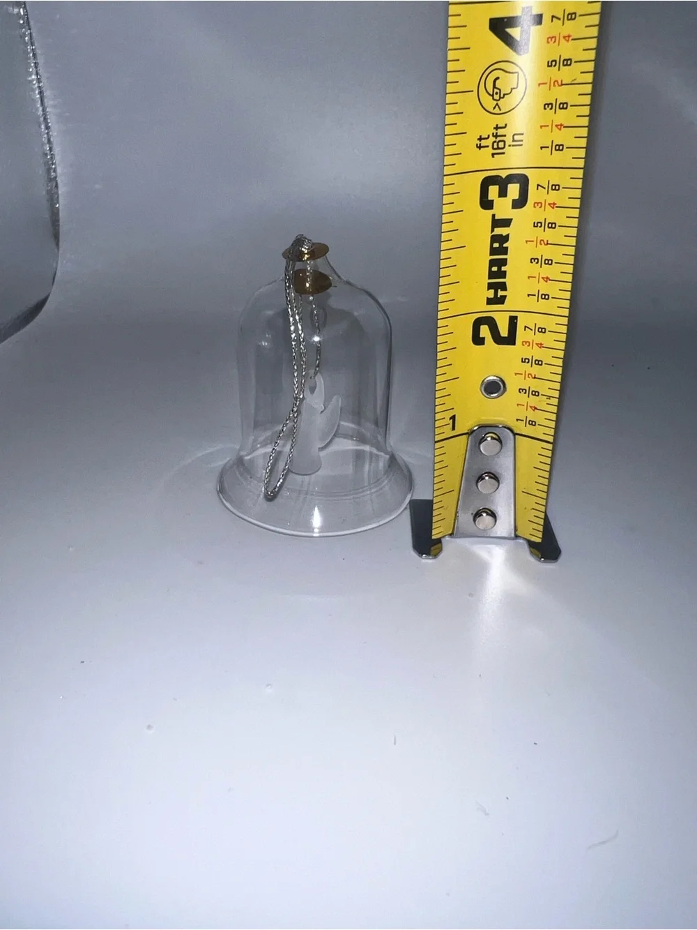 Small glass bell with angel